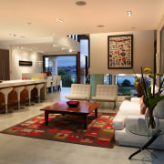 A view of the living area featuring polished interior design, living room, lobby, real estate, room, orange, brown