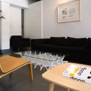 view of this apartment living area featuring clack chair, couch, furniture, interior design, living room, product design, property, room, table, waiting room, gray, black