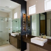 A view of the bathroom featuring tiled flooring, bathroom, countertop, interior design, room, sink, gray, brown
