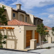 A view of the Point Ridge development. - building, cottage, facade, home, house, property, real estate, residential area, roof, villa, brown, teal