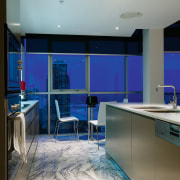 A view of the kitchen featuring marble flooring, architecture, ceiling, countertop, daylighting, floor, flooring, interior design, kitchen, real estate, room, wall, gray