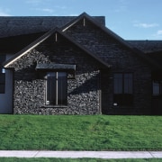 A view of this Rutherford Homes show home architecture, building, cottage, elevation, estate, facade, farmhouse, home, house, property, real estate, residential area, roof, siding, sky, suburb, window, black