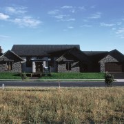 A view of this Rutherford Homes show home cottage, elevation, estate, facade, farmhouse, home, house, land lot, landscape, property, real estate, residential area, roof, sky, suburb, teal