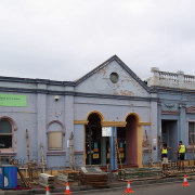 A view of an exterior restoration carried out building, transport, vehicle, white, gray