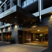 An exterior view of the Stamford Marque apartment architecture, building, condominium, facade, house, mixed use, real estate, black