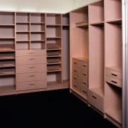 A view of the Walk in wardrobe featuring cabinetry, closet, cupboard, furniture, room, shelving, wardrobe, red