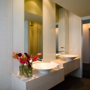 White glass between the mirrors adds a sheen bathroom, ceiling, interior design, room, gray, brown