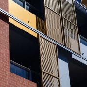 An exterior view of the discovery point apartment angle, architecture, brick, building, commercial building, daylighting, daytime, facade, glass, house, line, metropolitan area, residential area, sky, urban area, wall, window, black