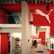 An interior view of the Puma outlet store architecture, ceiling, exhibition, interior design, red