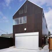 An exterior view of this house timbler cladding, architecture, building, facade, home, house, real estate, shed, gray