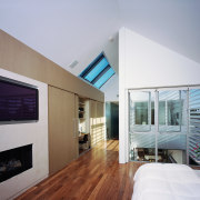 An interior view of the living area featuring architecture, ceiling, floor, house, interior design, real estate, window, gray