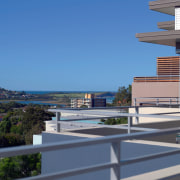 An exterior view of the Edgecliff Apartment Developments apartment, architecture, building, city, condominium, corporate headquarters, metropolitan area, mixed use, property, real estate, residential area, sky, blue, gray