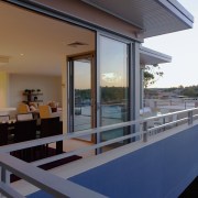 An exterior view of the Edgecliff Apartment Developments balcony, daylighting, house, real estate, roof, window, gray