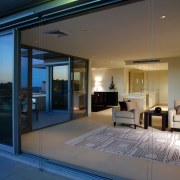 A view of the living area featuring carpet door, home, house, interior design, lighting, property, real estate, window, gray