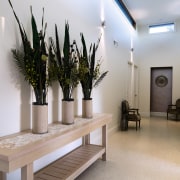 A view of this hallway featuring  tiled floor, flooring, furniture, interior design, gray
