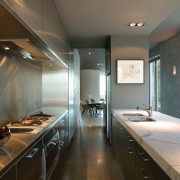 A view of this kitchen featuring polished concrete architecture, ceiling, countertop, interior design, kitchen, room, gray, brown