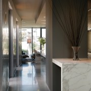 A view of this kitchen featuring polished concrete architecture, ceiling, floor, flooring, home, house, interior design, lobby, real estate, black, gray