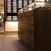 An interior view of the Rhodes &amp; beckett cabinetry, chest of drawers, drawer, floor, flooring, furniture, hardwood, interior design, wood, black, brown