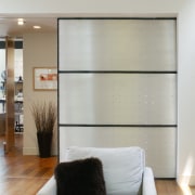 An interior view of the living area featuring ceiling, floor, furniture, interior design, living room, room, wall, window, gray