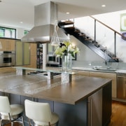 A view of the kitchen featuring modern stainless countertop, interior design, kitchen, real estate, gray
