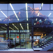 An exterior view of this glass and steel airport terminal, architecture, building, convention center, daylighting, facade, metropolitan area, mixed use, structure, teal