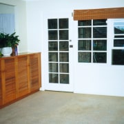 A complete rethink of the residence's rear wall, door, floor, house, property, shelving, window, white