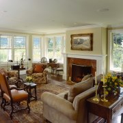 An interior view of the living space featuring ceiling, estate, home, house, interior design, living room, property, real estate, room, window, gray, brown