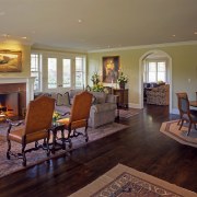 An interior view of the living space featuring ceiling, dining room, estate, floor, flooring, hardwood, home, house, interior design, laminate flooring, living room, real estate, room, wood, wood flooring, brown, red