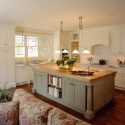 An interior view of the living space featuring cabinetry, countertop, cuisine classique, floor, flooring, hardwood, home, interior design, kitchen, living room, real estate, room, window, wood flooring, gray, orange