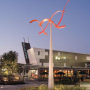 A view of Sylvia Park. - A view architecture, building, daytime, dusk, energy, evening, landmark, light fixture, lighting, residential area, sky, street light, wind, wind turbine, blue, black