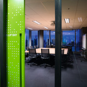 A view of the meeting room featuring table, architecture, ceiling, glass, interior design, lighting, office, black, green