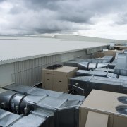 A view of an air conditioning unit from architecture, roof, water, gray