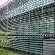 A view of the louvres/sunshades installed on the architecture, building, condominium, facade, fence, window, gray