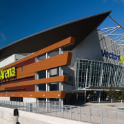 A view of the Vector Arena in Auckland architecture, building, commercial building, convention center, corporate headquarters, facade, headquarters, mixed use, sky, sport venue, stadium, structure, blue, black