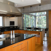 A view of the kitchen featuring bamboo flooring, countertop, interior design, kitchen, property, real estate, gray