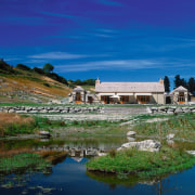 An exterior view of this rural farmstead house bank, cloud, lake, landscape, loch, mount scenery, mountain, nature, real estate, reflection, reservoir, rural area, sky, tree, water, water resources, blue