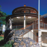 An exterior view of the family home designed building, estate, facade, house, outdoor structure, property, real estate, villa, black