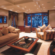 An interior view of the living area featuring home, interior design, living room, room, brown