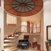 A view of the entrance foyer featuring tiled ceiling, daylighting, estate, interior design, lobby, real estate, brown, white