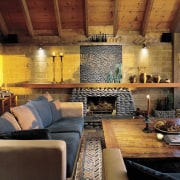 An interior view of the living area featuring ceiling, fireplace, hearth, home, interior design, living room, real estate, room, wall, wood, brown