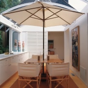 An interior view of the living areas featuring daylighting, furniture, real estate, roof, table, white, brown