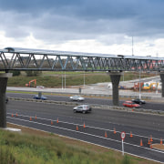A view of some work done by Auckland bridge, car, controlled access highway, extradosed bridge, fixed link, girder bridge, highway, infrastructure, lane, metropolitan area, overpass, road, sky, skyway, transport, urban area, gray
