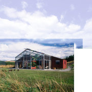 An exterior view of this steel fraed glass architecture, barn, cloud, cottage, farm, farmhouse, home, house, hut, land lot, landscape, real estate, rural area, shed, sky, structure, white