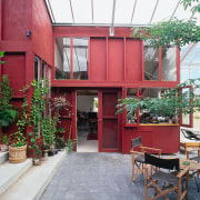 An interior view of the glasshouse where the architecture, balcony, courtyard, facade, home, house, real estate, red, white