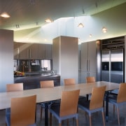 An interior view of the living areas featuring architecture, ceiling, countertop, dining room, interior design, real estate, table, gray