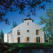 An exterior view of this rural home designed architecture, building, cloud, cottage, estate, facade, farmhouse, home, house, landmark, mansion, plant, property, real estate, residential area, sky, suburb, tree, black, blue