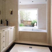 A view of the master bathroom featuring recessed bathroom, countertop, floor, home, interior design, kitchen, property, real estate, room, sink, window, gray, brown