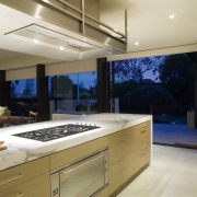 A view of this kitchen featuring clalcutta marble cabinetry, countertop, interior design, kitchen, gray, brown