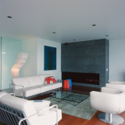 An interior view of the living areas featuring architecture, ceiling, floor, house, interior design, living room, room, table, gray