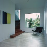 A view of the hallway featuring grey tiber architecture, daylighting, floor, flooring, hardwood, house, interior design, laminate flooring, living room, window, wood, wood flooring, gray
